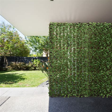 Consider adding some accessories to your new fence to spice up your outdoor space even more. . Ivy privacy screen